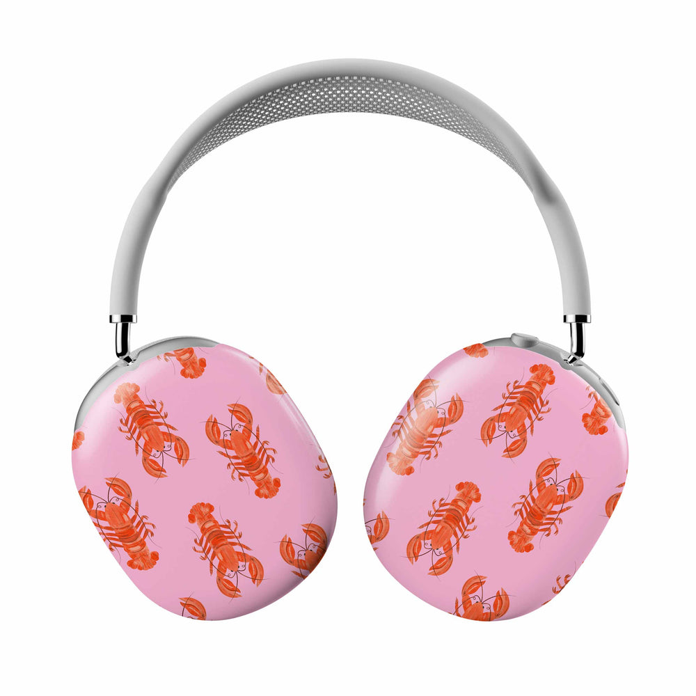 Pink headphones with orange lobster pattern on a white background