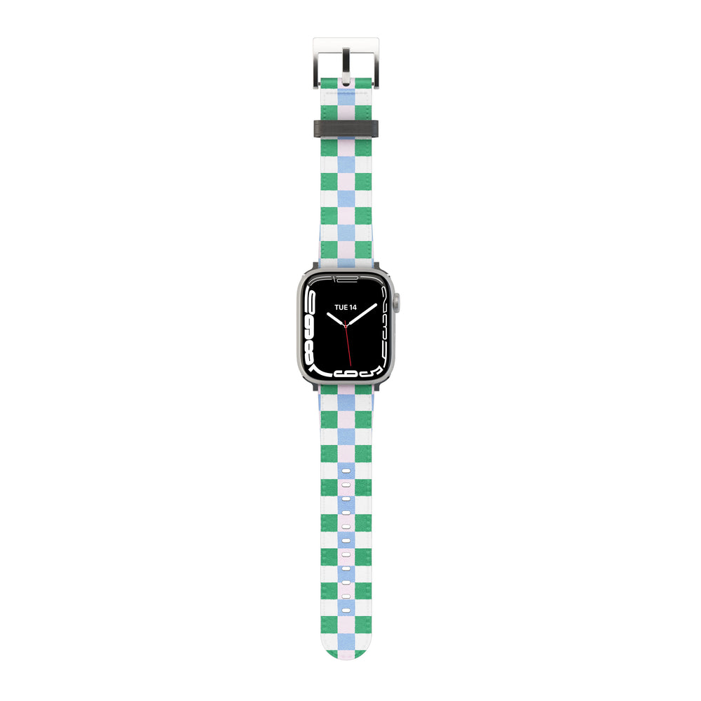 Smartwatch with a green and light blue & pink checkered band on a white background