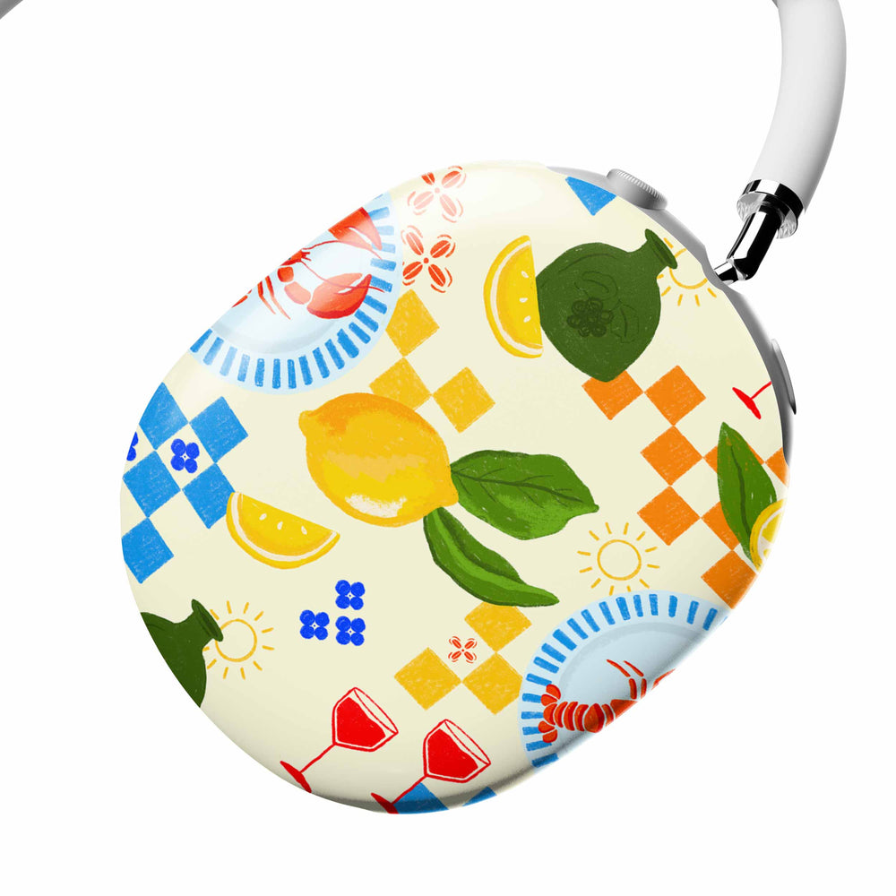 Casetify Colorful headphones with a pattern of lemons, flowers, and other designs on a white background.