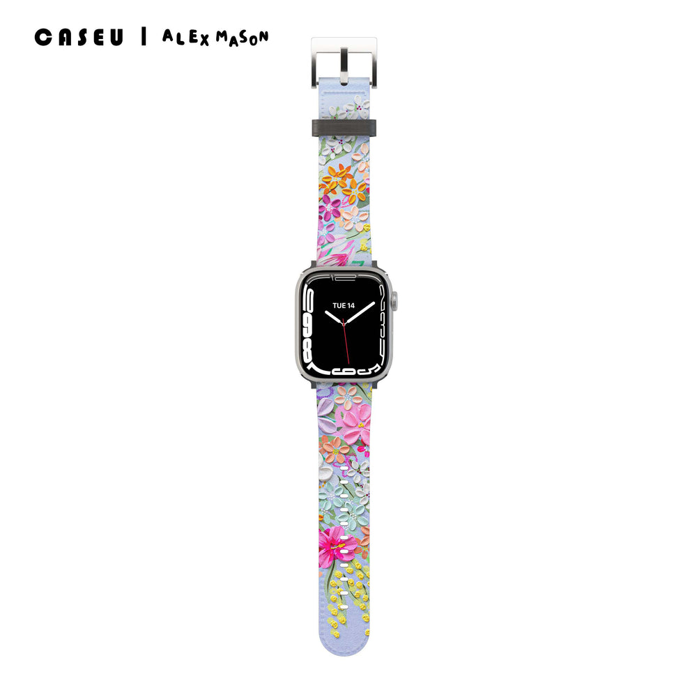 A multicolored floral Apple Watch band with a digital display showing the time.