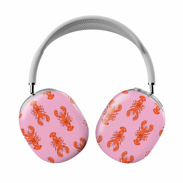 Pink headphones with orange lobster pattern on a white background