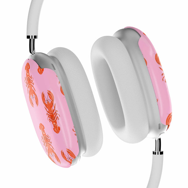Headphones with pink ear cushions featuring lobster designs on a white background