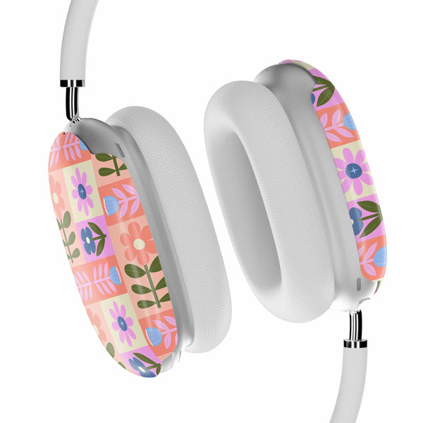 Casetify White headphones with floral patterned ear cushions on a white background
