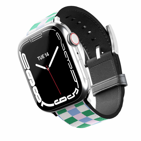 Smartwatch with a  green and light blue and pink grid band and black strap on a white background