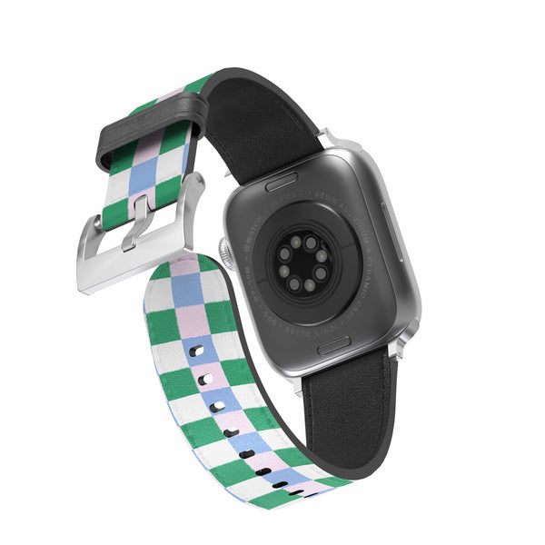 Smartwatch with a green and blue and pink checkered band on a white background