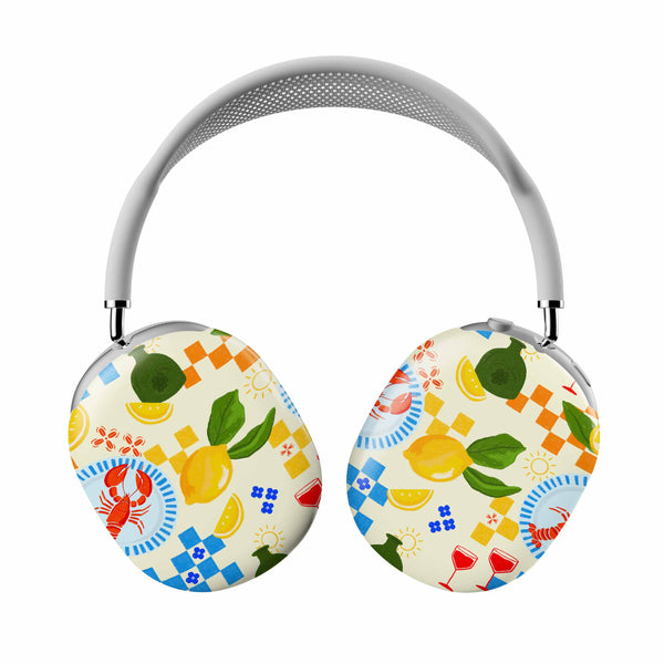 Casetify Colorful headphones with a pattern of lemons, flowers, and other designs on a white background.