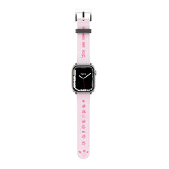 A pink Apple Watch band with white text and design, featuring a digital display on the watch face.