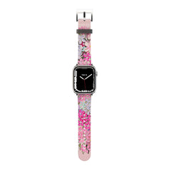 A pink and purple floral-patterned Apple Watch band with a metal buckle clasp.