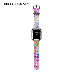 A multicolored floral-patterned Apple Watch band with a metal clasp, designed by Alex Mason.